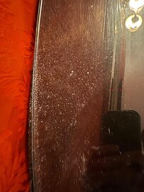 Dust that came out of picture on the wall after gently touching it