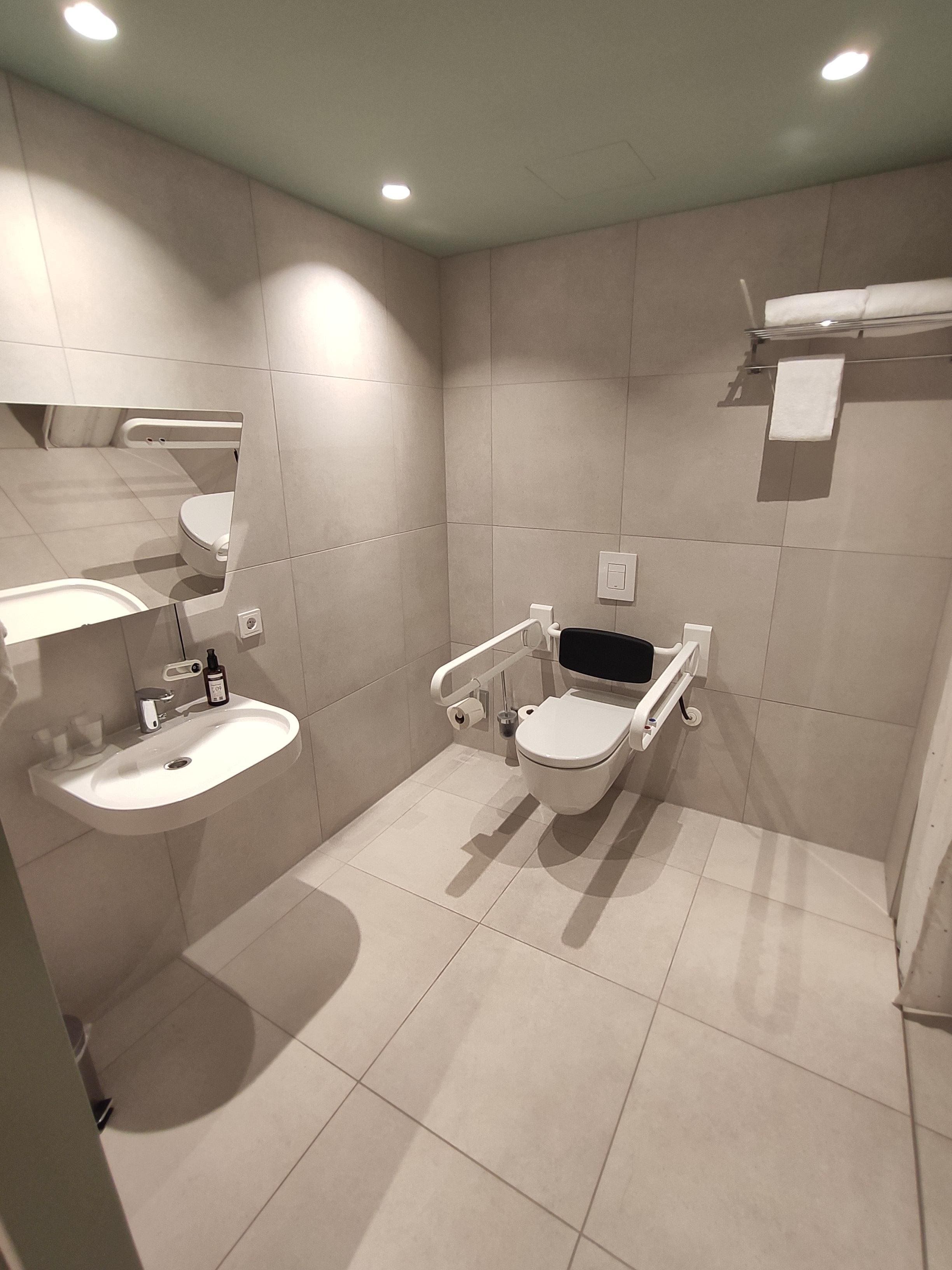 Fantastic accessible bathroom, adjustable mirror.