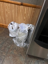 Overflowing trash in common area
