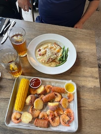 Our meals from Huey’s Seafood on River St.
Low country boil and salmon and grits