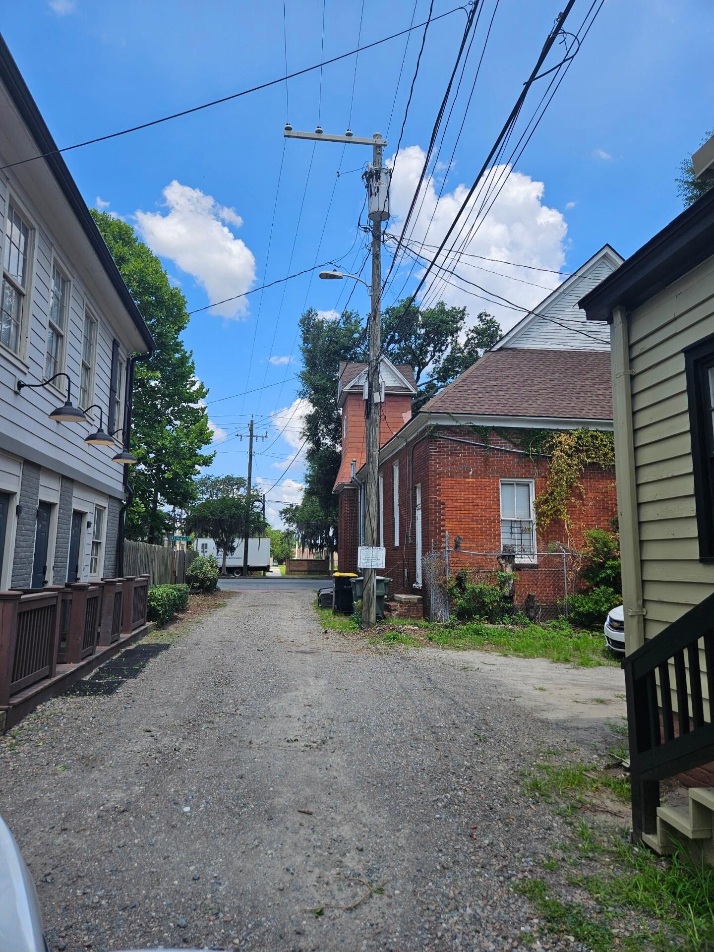 Alley entrance, building on left.