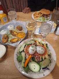 Bacon cheeseburger, loaded potatoes and a chefs salad