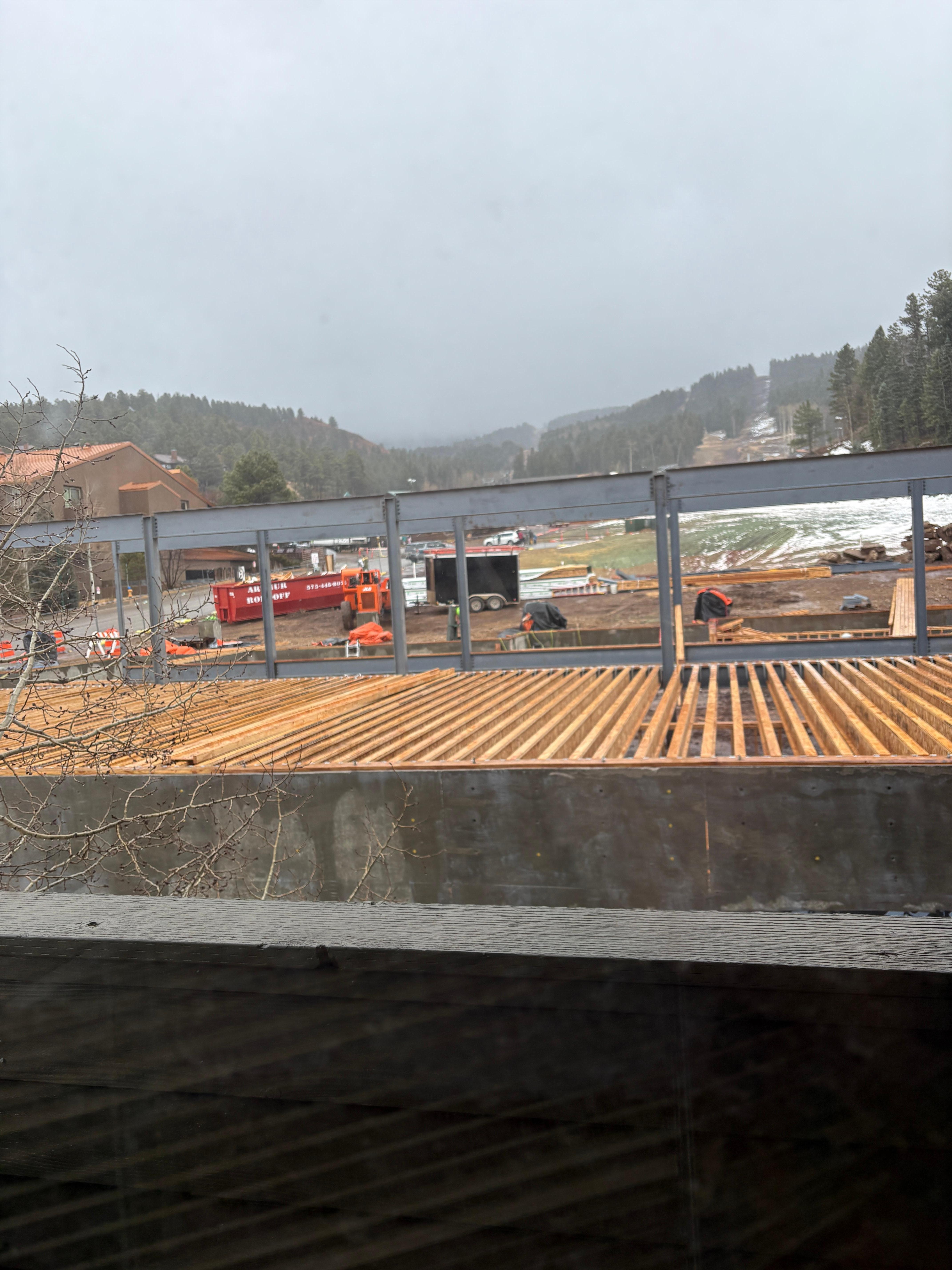 Construction right outside the master window of new ski lift being installed. 