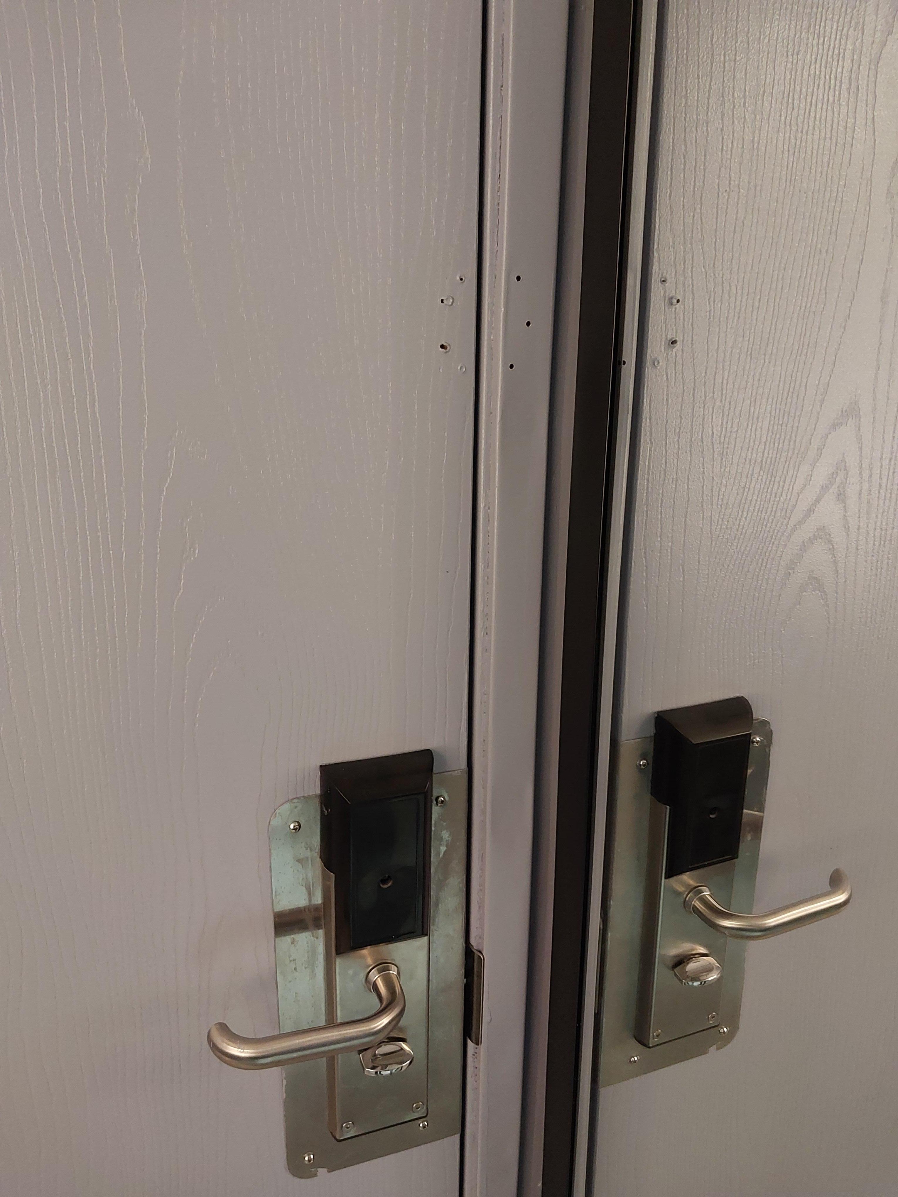 Missing security latch. Note holes in door and trim where it was.
