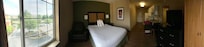 Panoramic of bedroom and kitchenette