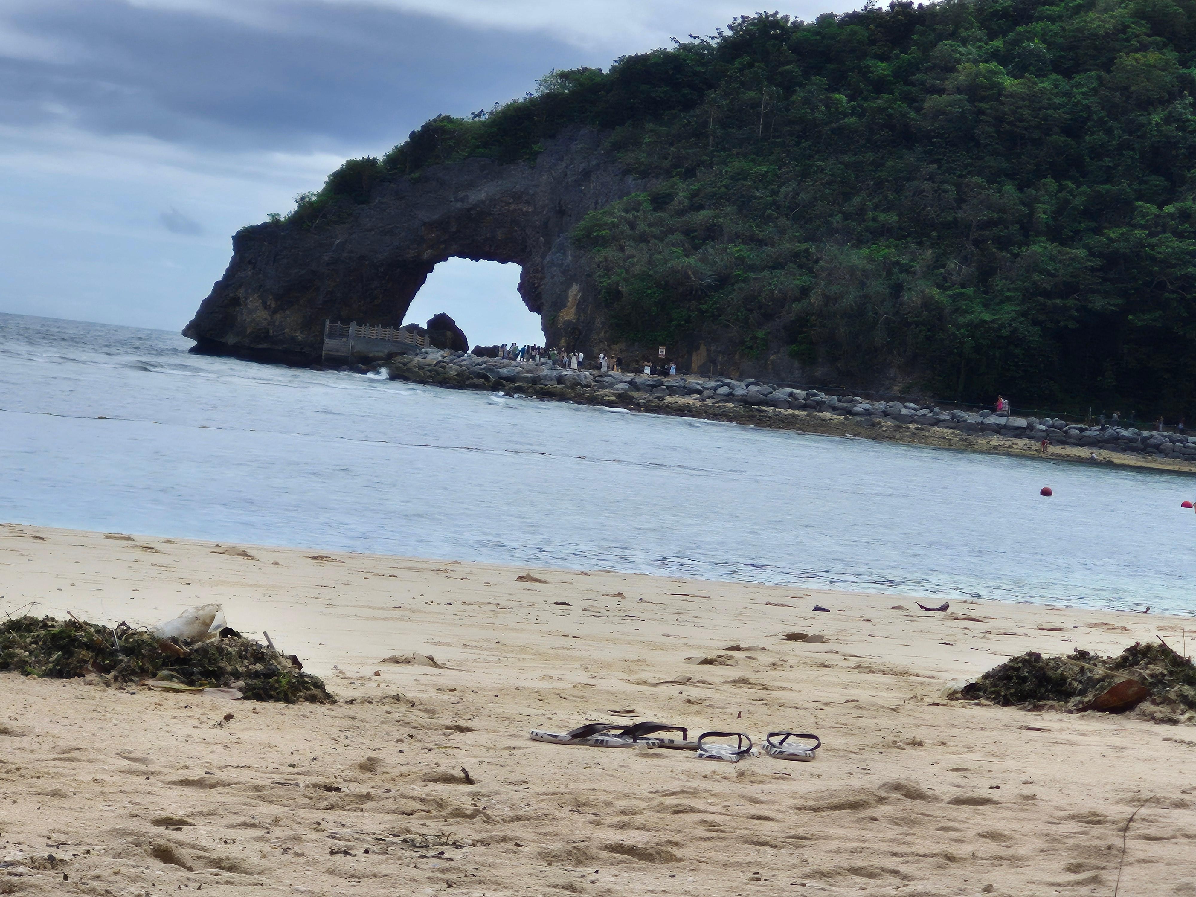 The private beach at the bottom of their infinity pool