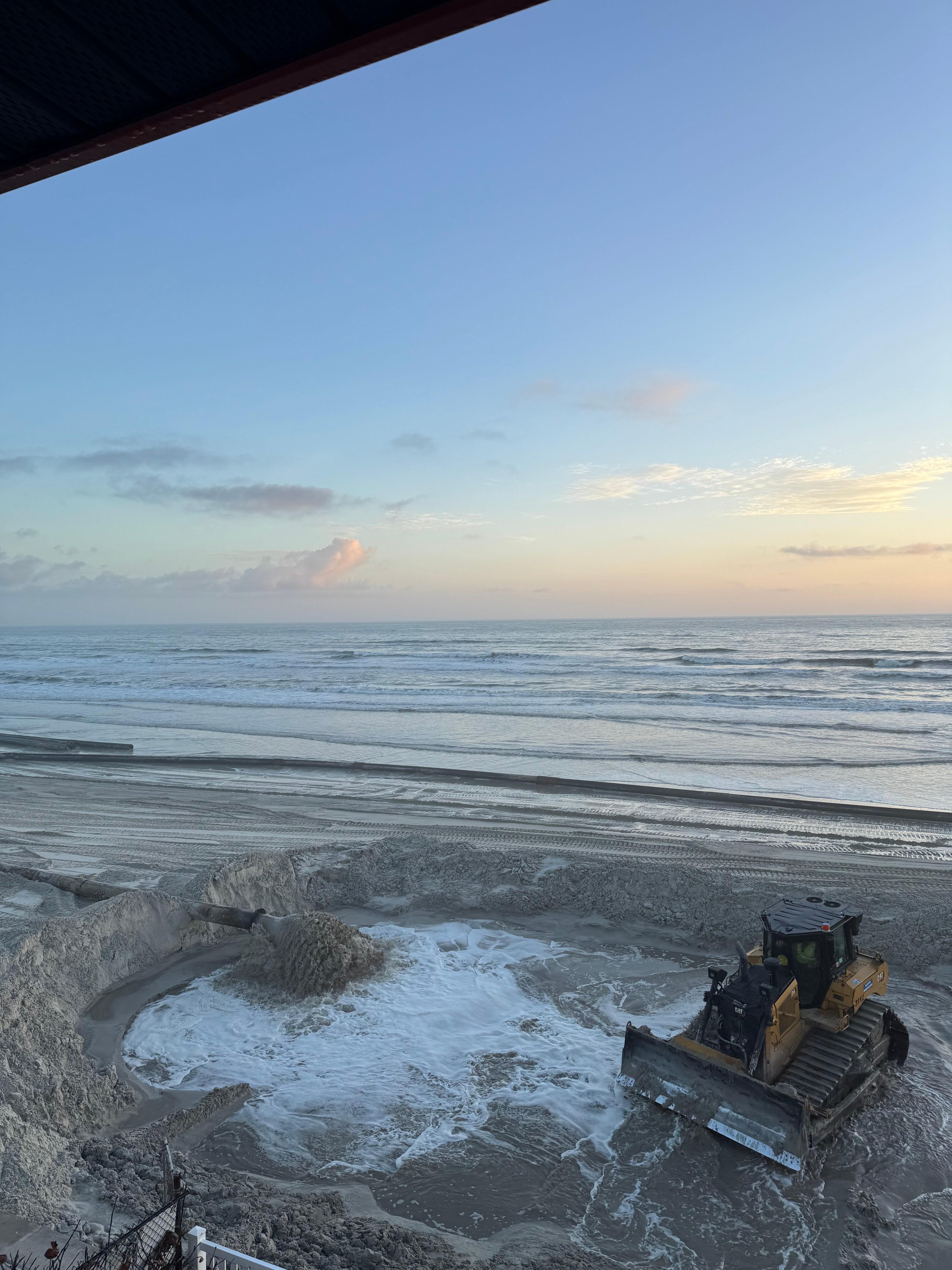 view of construction/beach from balcony.