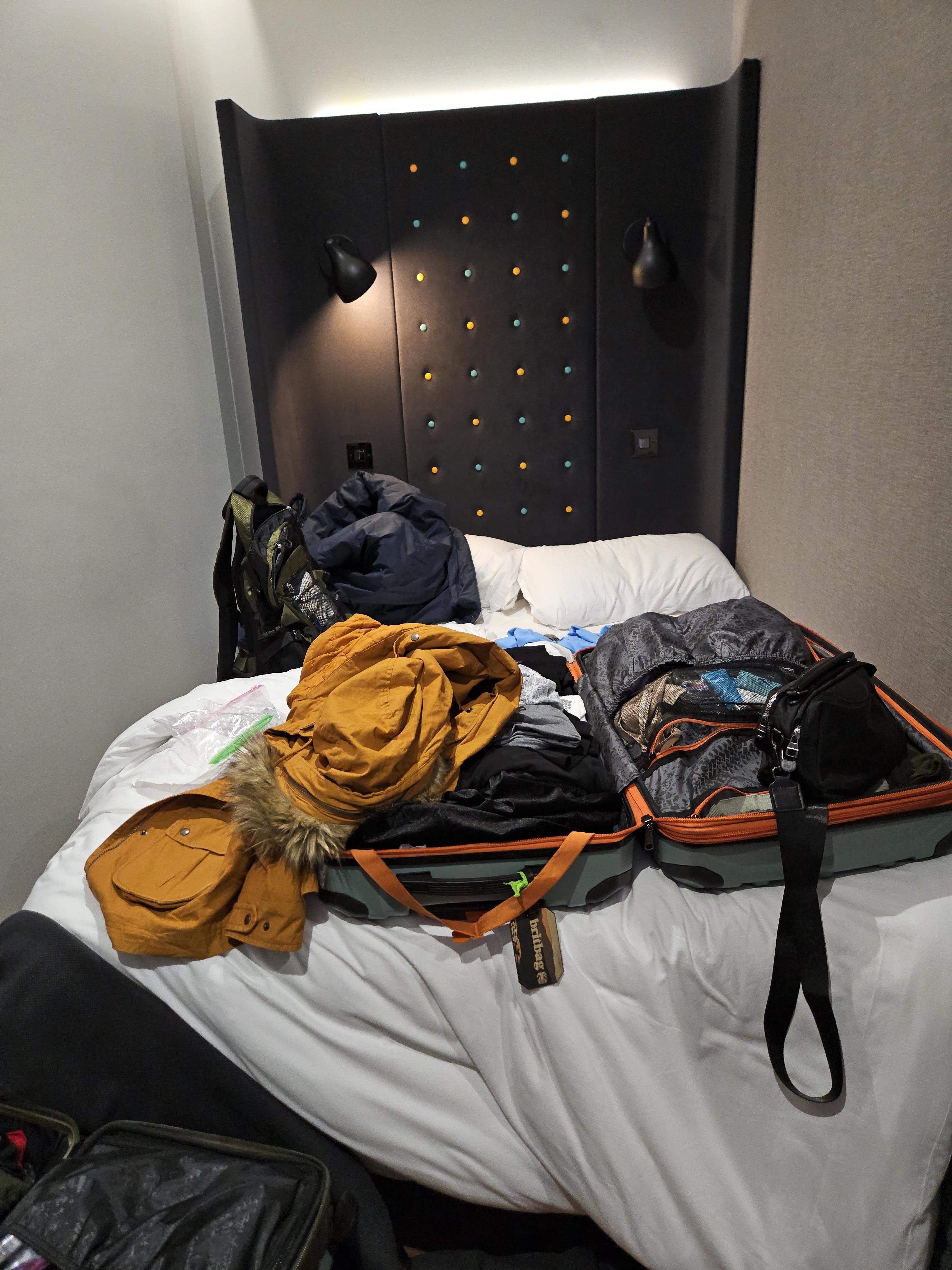 Full size bed filled the cubby of this room. 