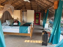 Curtains for walls on the interior and woven reeds on the outside for air flow.