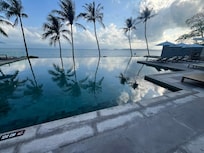 Infinity pool and beach beyond
