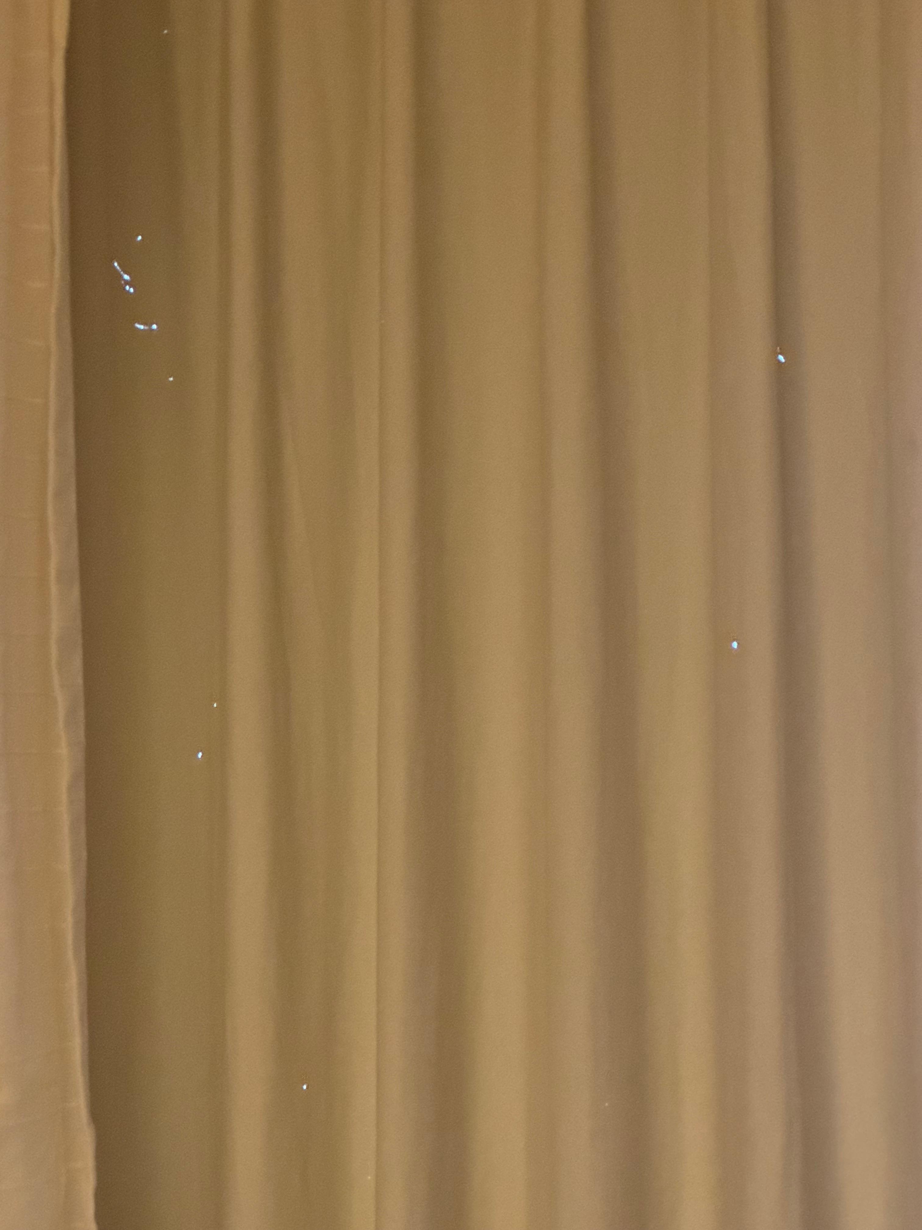 Holes all through the curtains.