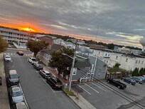 Front balcony sunset on our rainy day