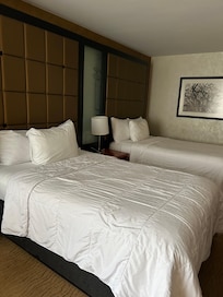 Large corner room with 2 Double Beds and a city view
