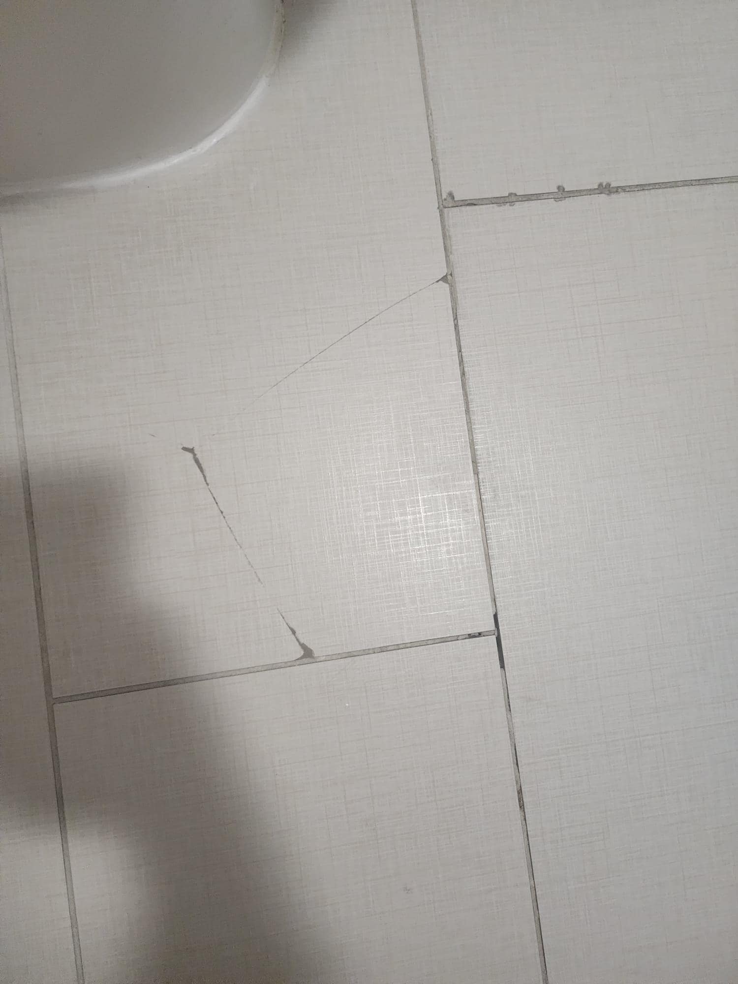 Broken tile in the washroom
