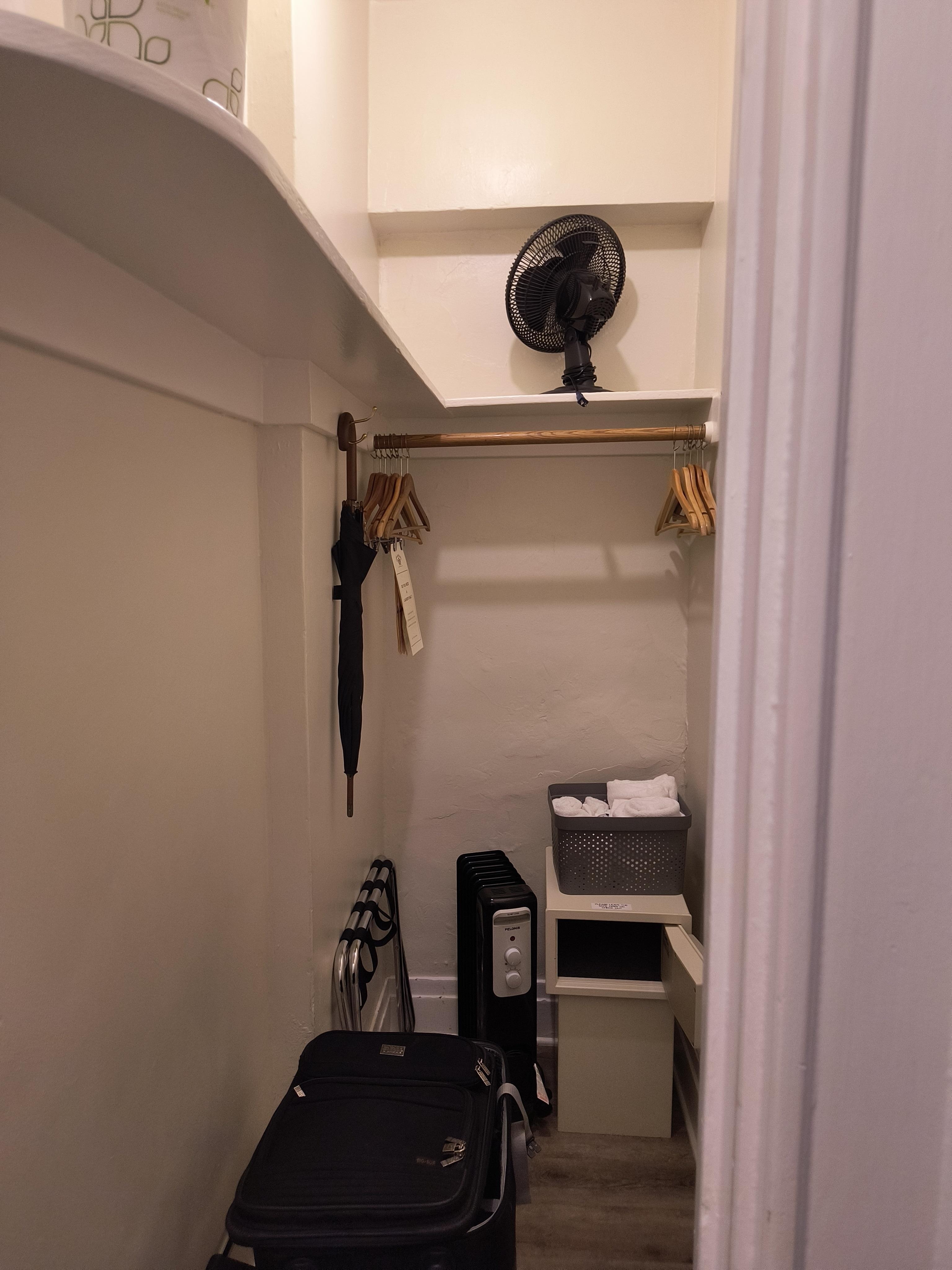 Ample closet with all you need including full size ironing board to the right out of shot.