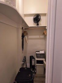 Ample closet with all you need including full size ironing board to the right out of shot.