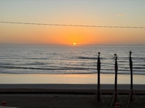 Sunrise from the balcony, with the newly planted palm trees.