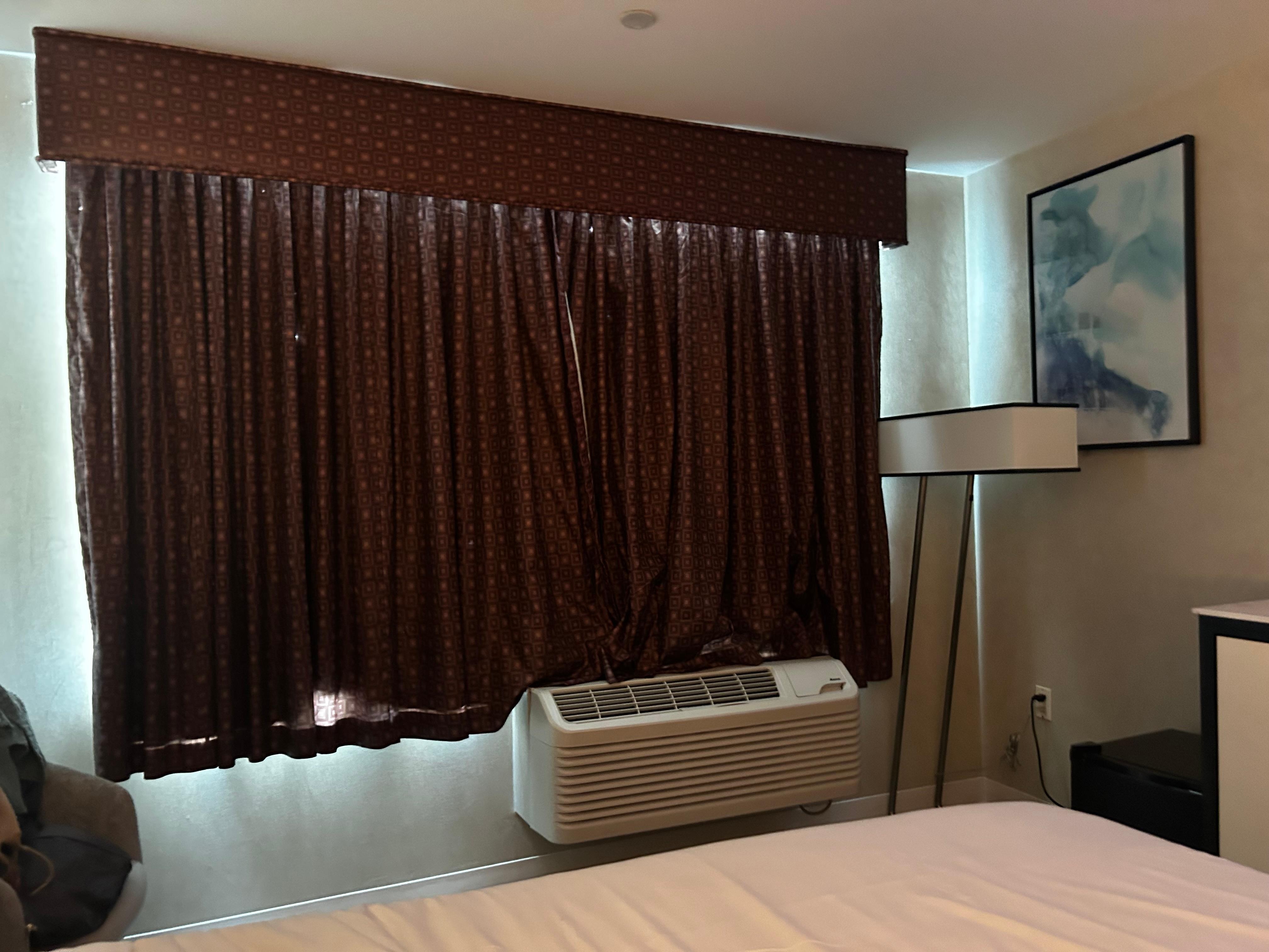 Window drapes add a wonderful touch of class to the room.