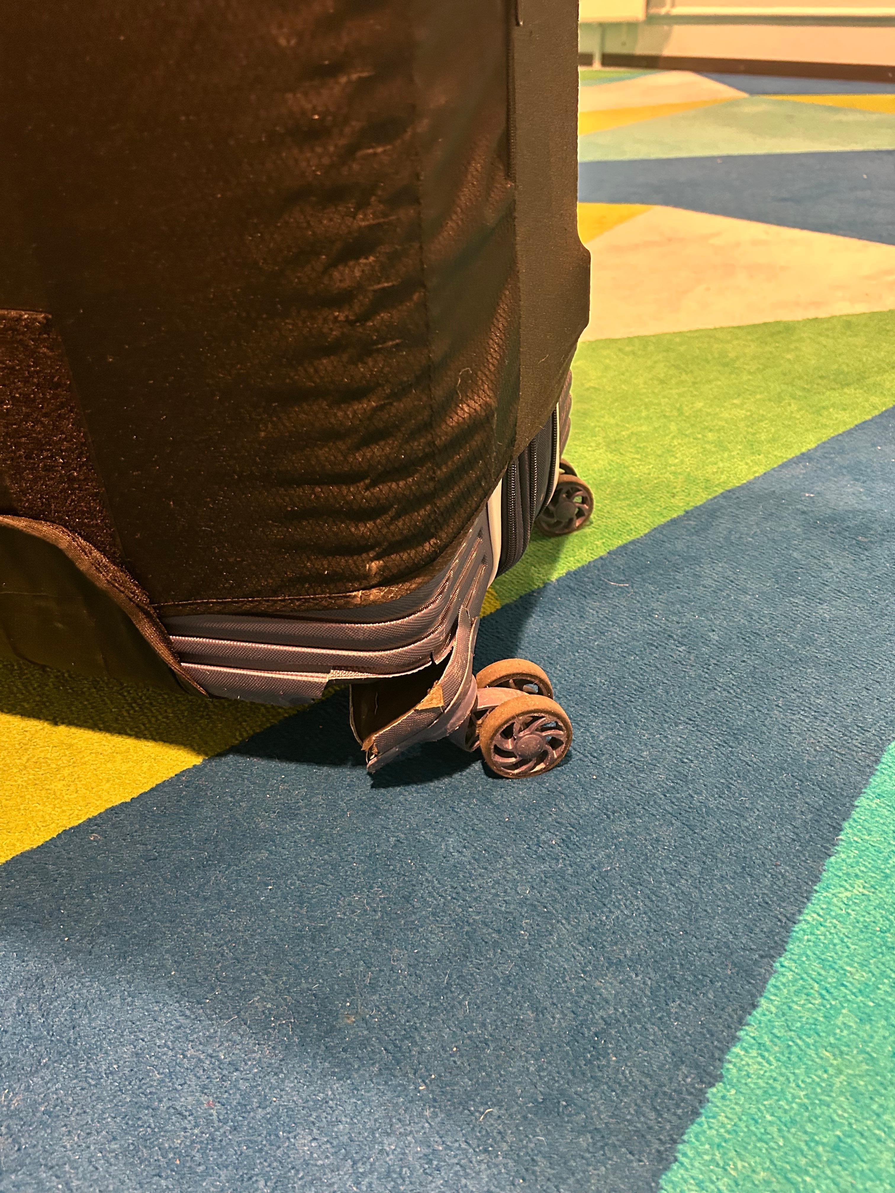 Broken luggage wheel after carrying heavy weight by ourselves to inaccessible room with no help and dismissing from staff 