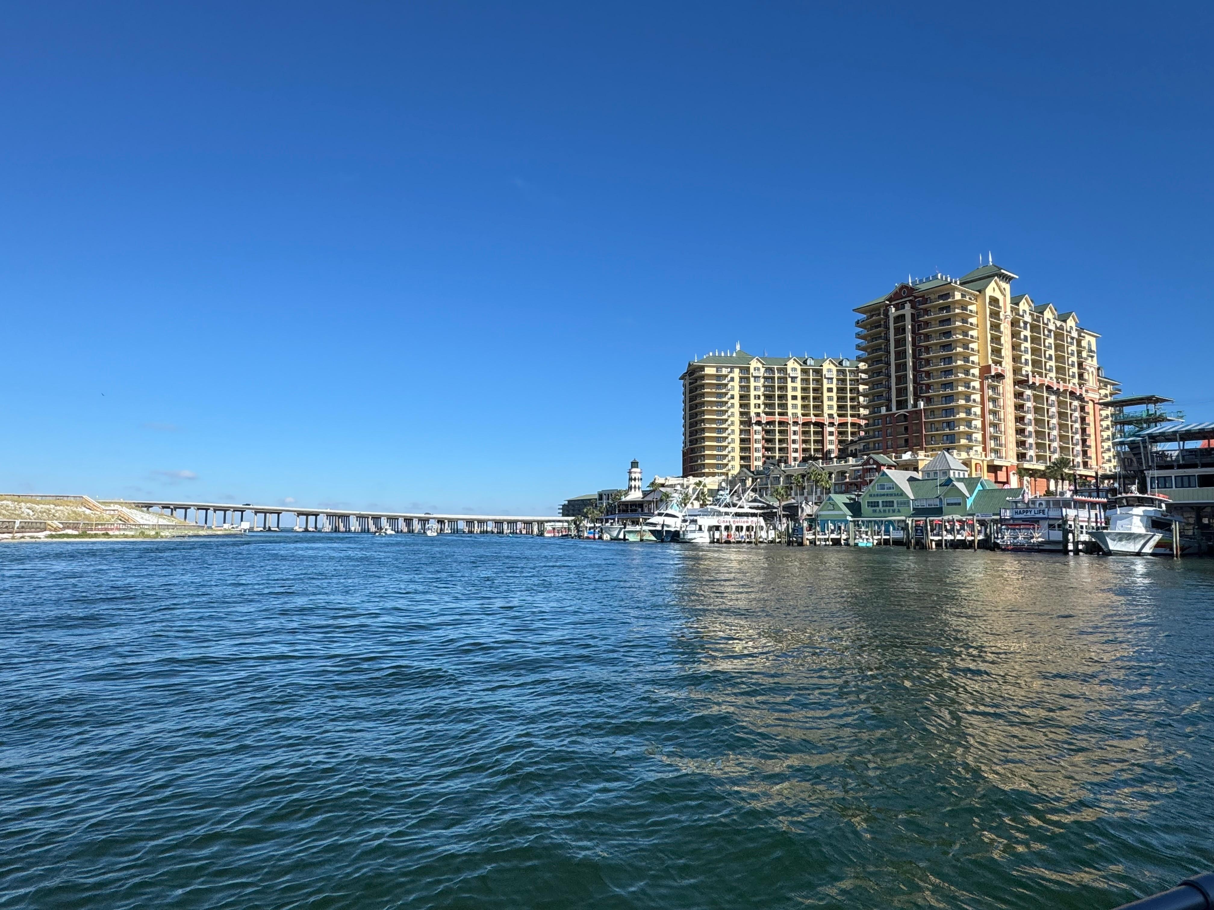 Another great view of Destin Harbor with crab Island just beyond the bridge in the background