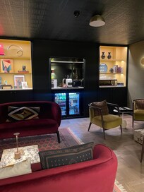 Adorable + chic bar/lounge area stocked with coffee, drinks & games - heaven.