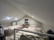 Only issue - Loft has very low ceiling- about 5’6” at the peak - maybe 30” at the sides. Would be great for kids but not good for old folks with bad knees when the description said it was a queen BED not twin mattresses on the floor.