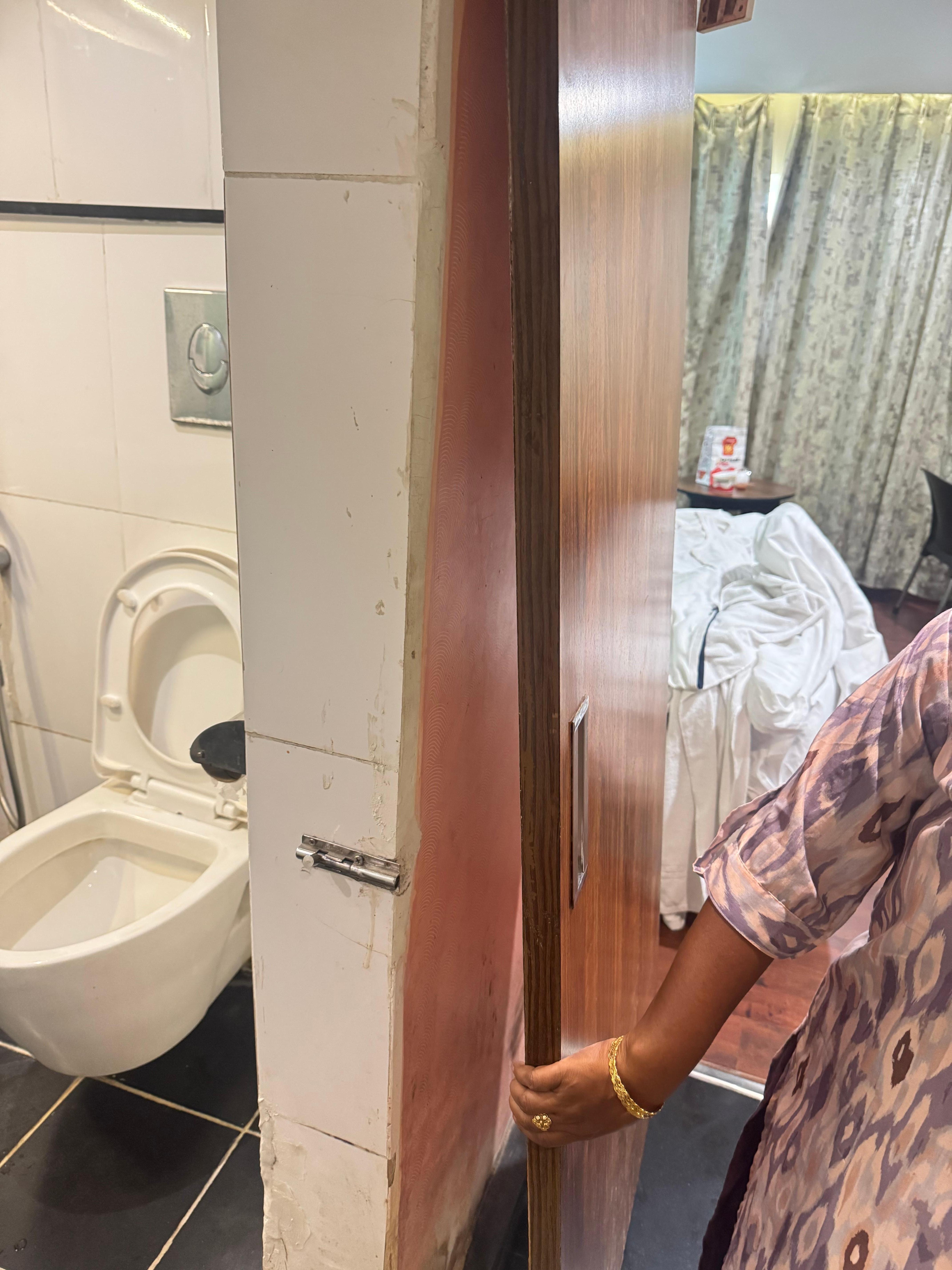 Look at the bathroom door and its condition 