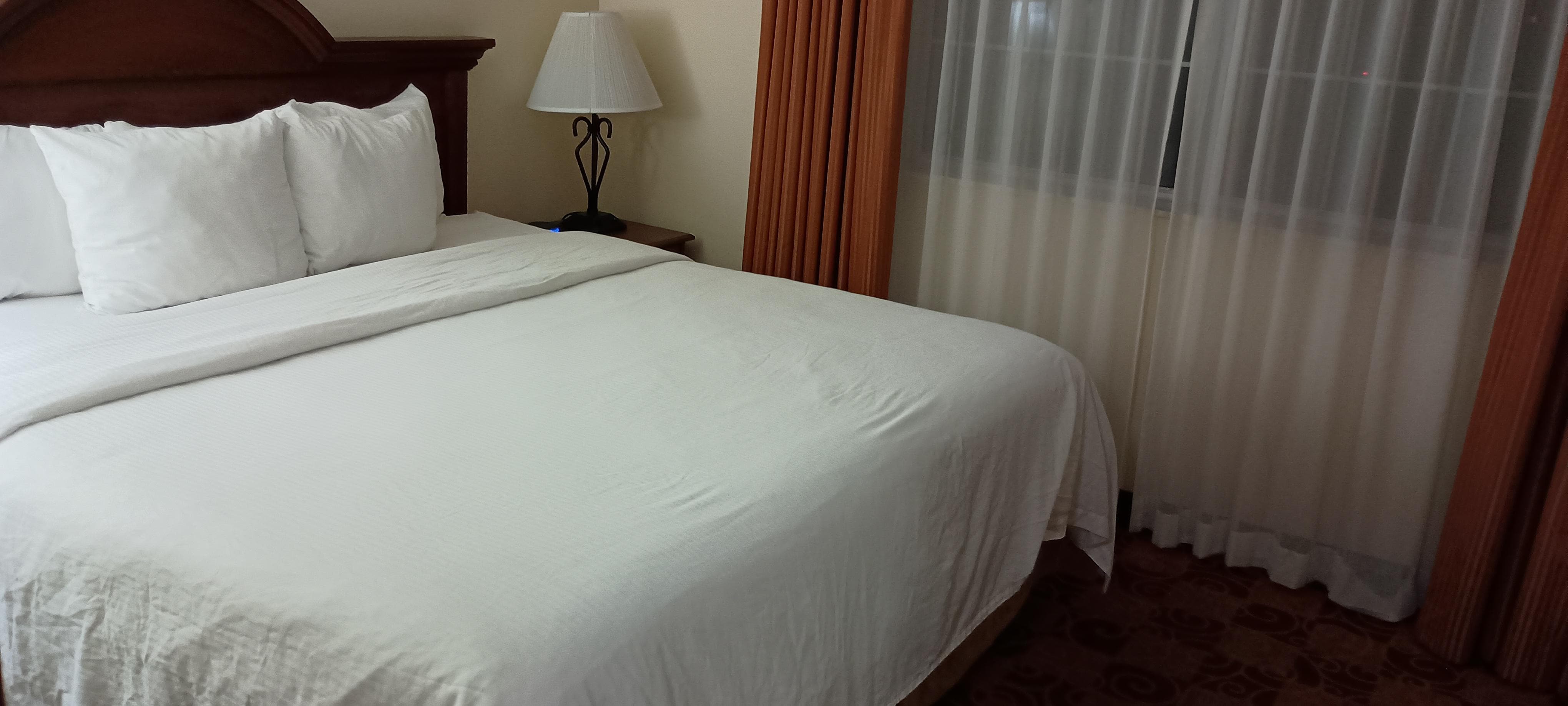 Comfortable bed with TV in the room. 