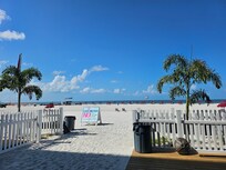 Looking out from the ground floor to go out to the beach. Food, bar, picnic tables and couple stores here too.
