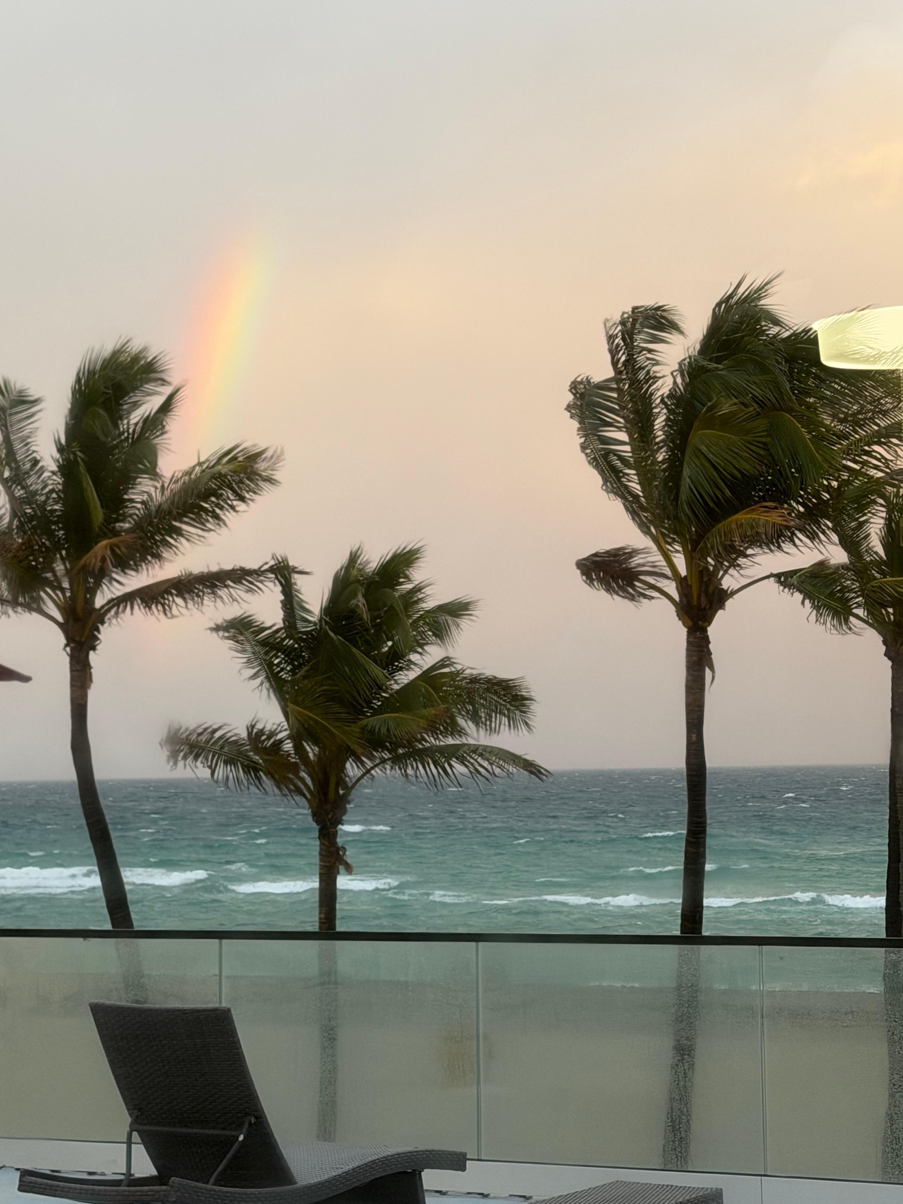 Shared Balcony, it is nice, with lounge chairs and tables with umbrella’s  