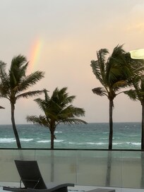Shared Balcony, it is nice, with lounge chairs and tables with umbrella’s