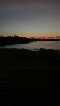 View of the sunset from the deck of the house.