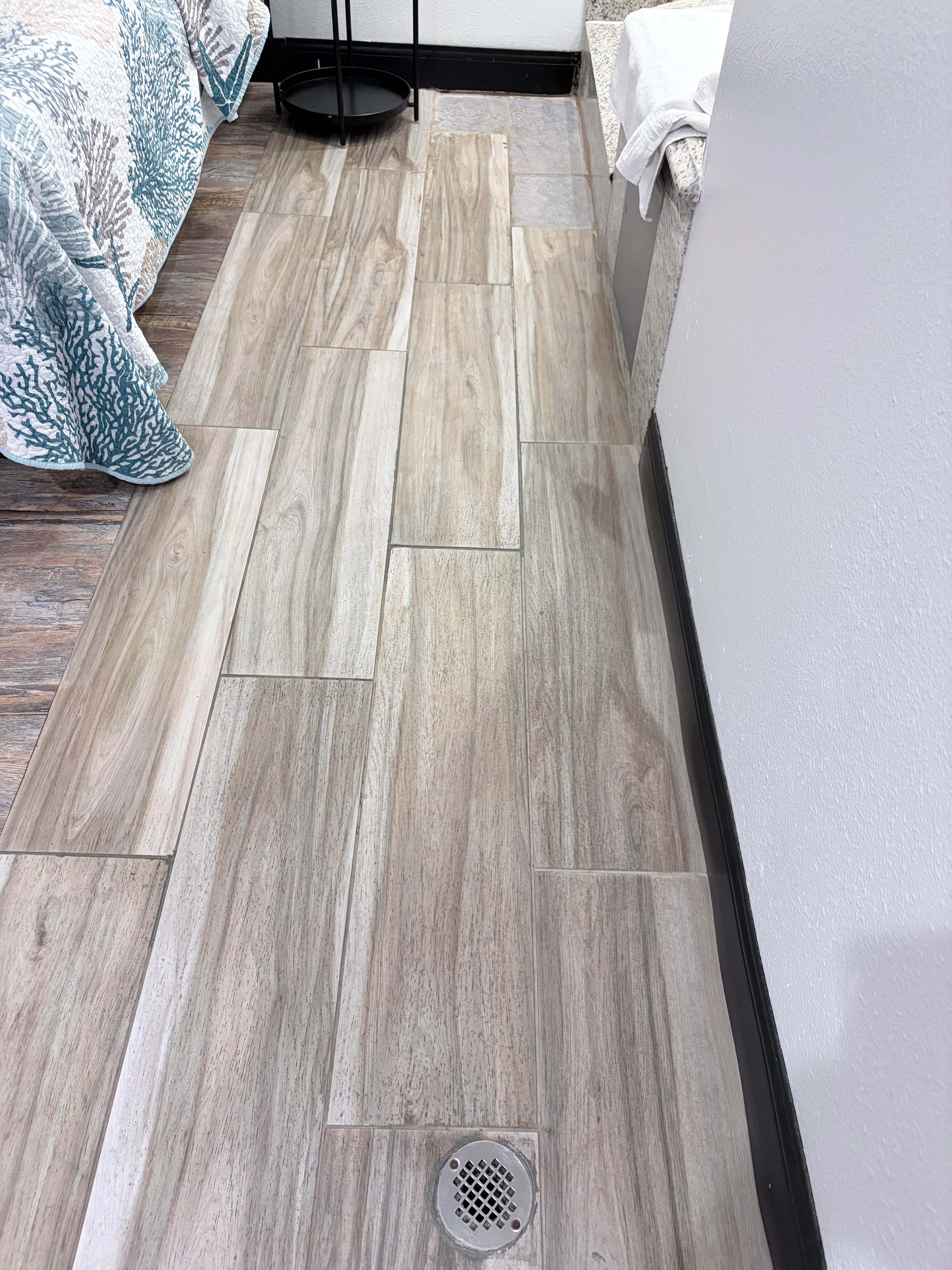 Water splattered on the floor and onto the bed too.