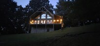 Evening shot with lights on great spot for front porch sitting enjoying the sunsets