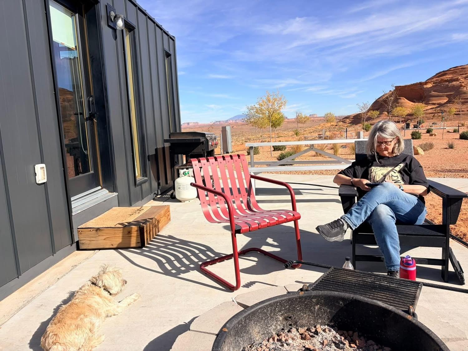 The fire pit and chairs outside the front door.