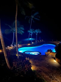 Pool at night with the Bioluminescence (green glow phenomenon ) in the background by the cove