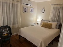 Bedroom is cozy.