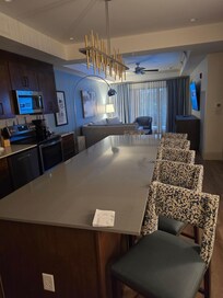 Island with chairs in the kitchen area.