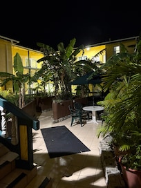 The courtyard for the garden rooms across the street