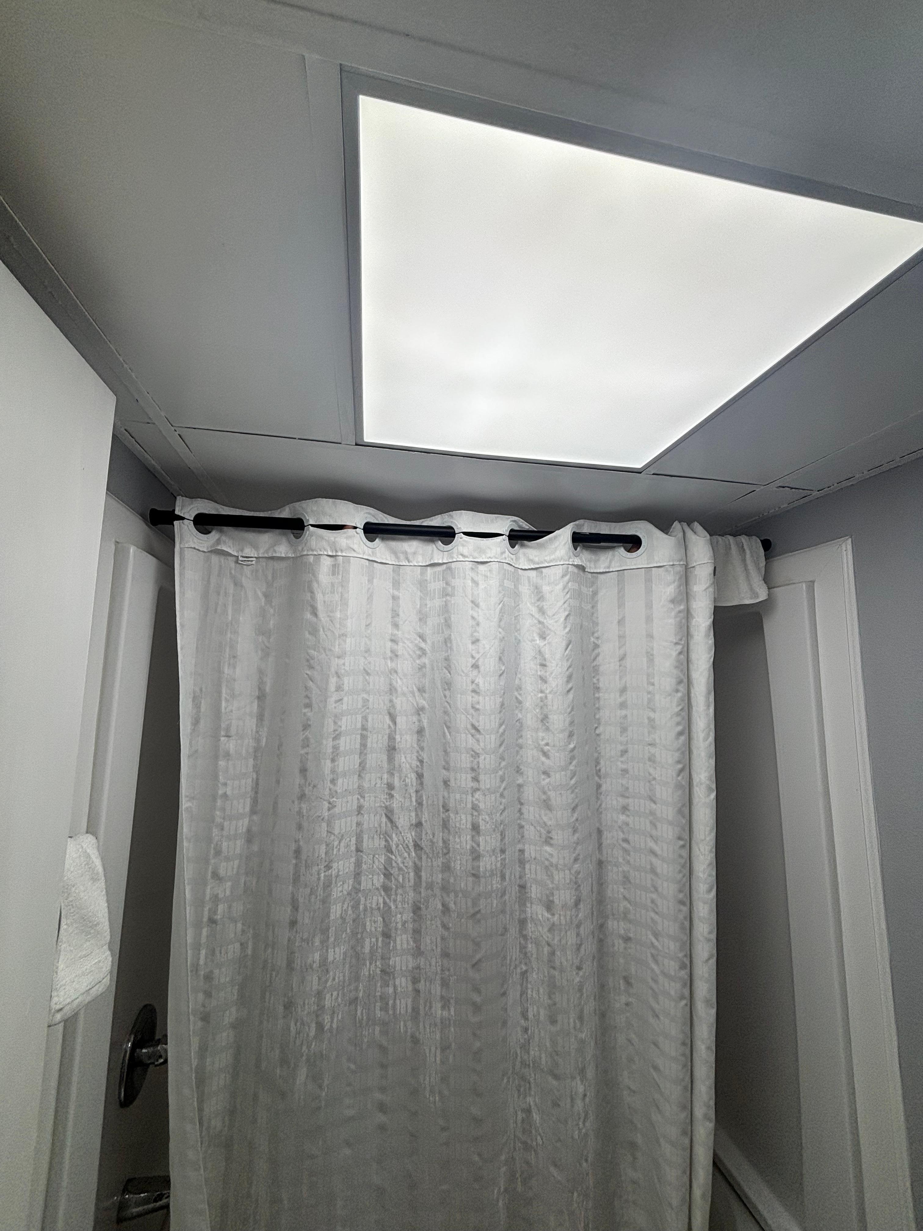 The shower rod was not attached to anything.