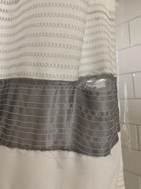 Torn shower curtain