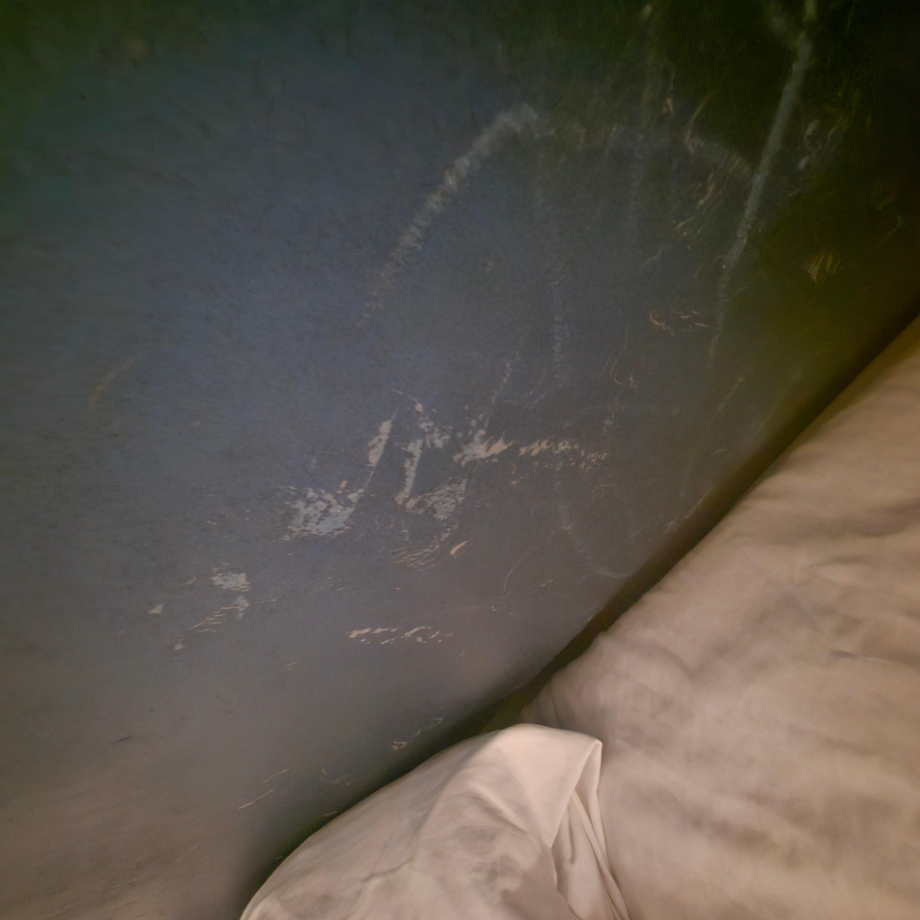 Dirty and scratched up headboard.
