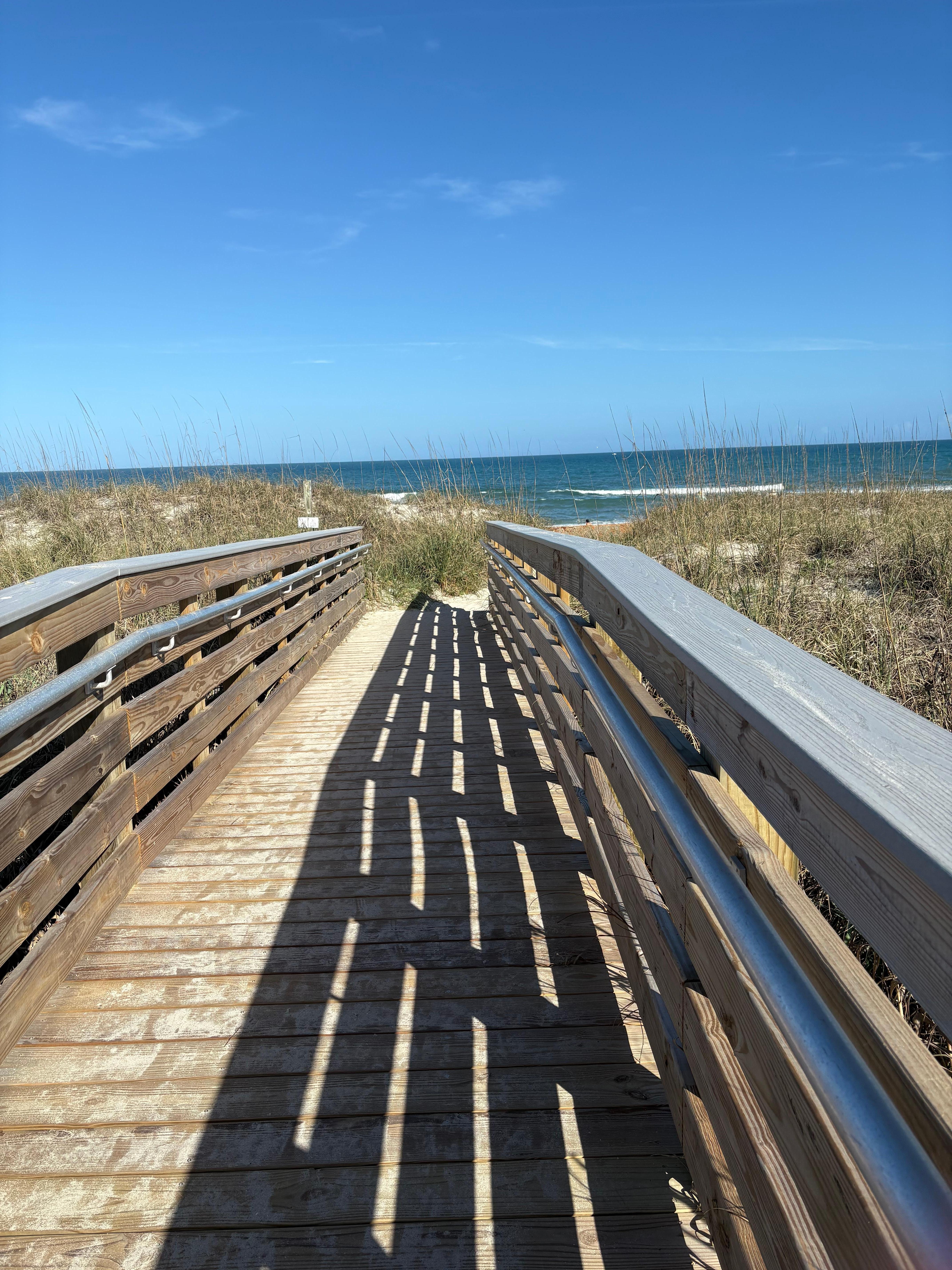 Boardwalk to beach is sturdy and connected to condos. 