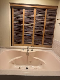 Includes jacuzzi tub.