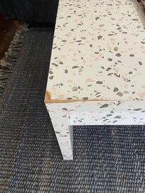 Pressboard coffee table in poor condition -part of the hodgepodge of furniture