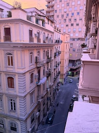 Balcony view of the side street below.