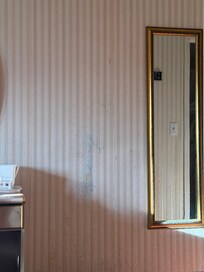 Marker or crayon all over the wall, wallpaper peeling