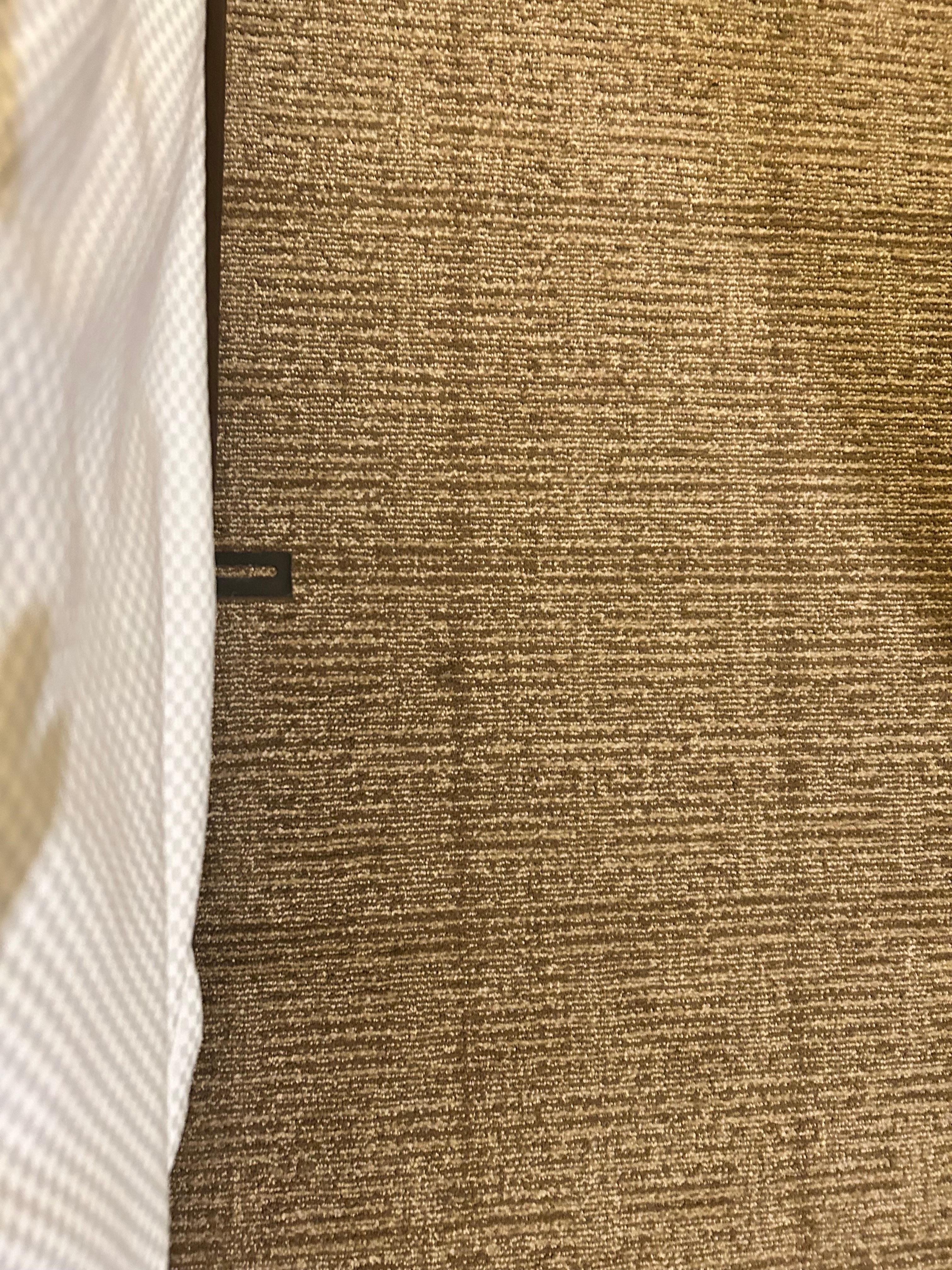 Room 115 metal piece sticking out from bed towards head