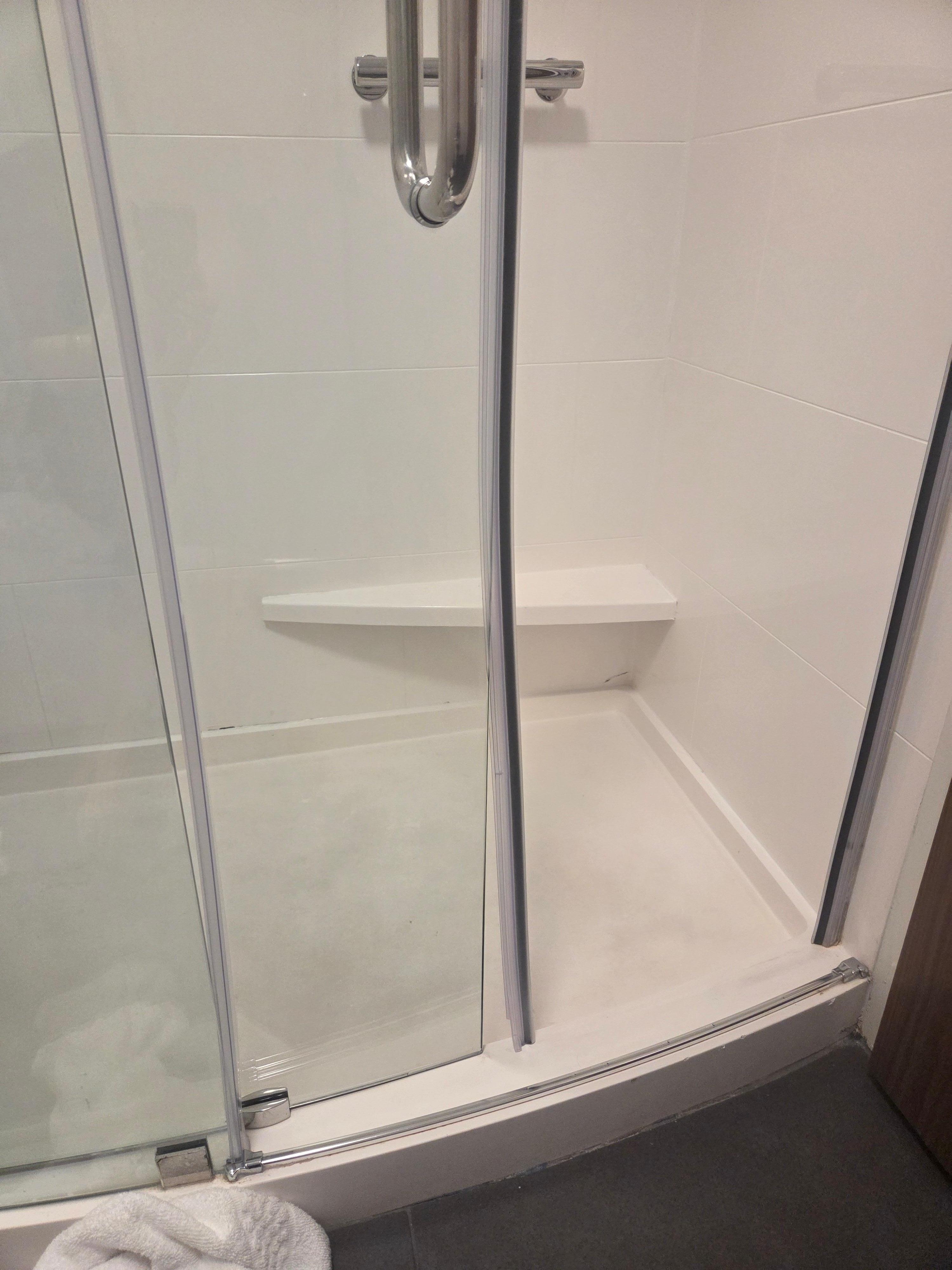 Shower gasket was coming off door and water was leaking on floor