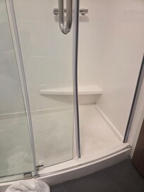 Shower gasket was coming off door and water was leaking on floor